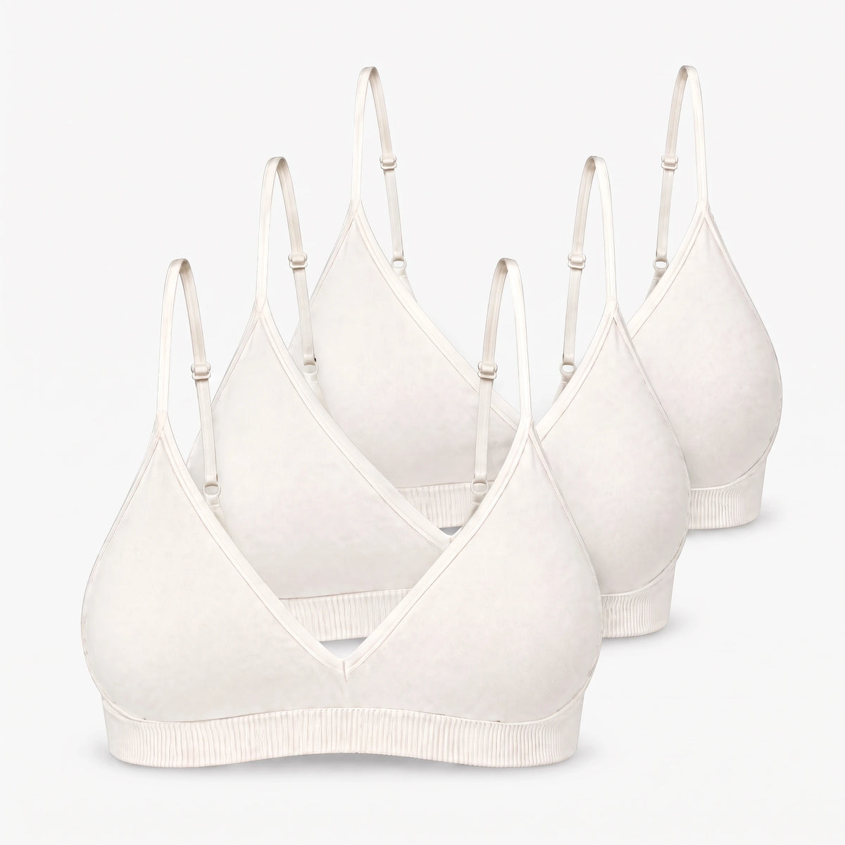 {"alt": "Seamless Triangel Bralette - Oberteile - Cremeweiß", "quantity":"3"}